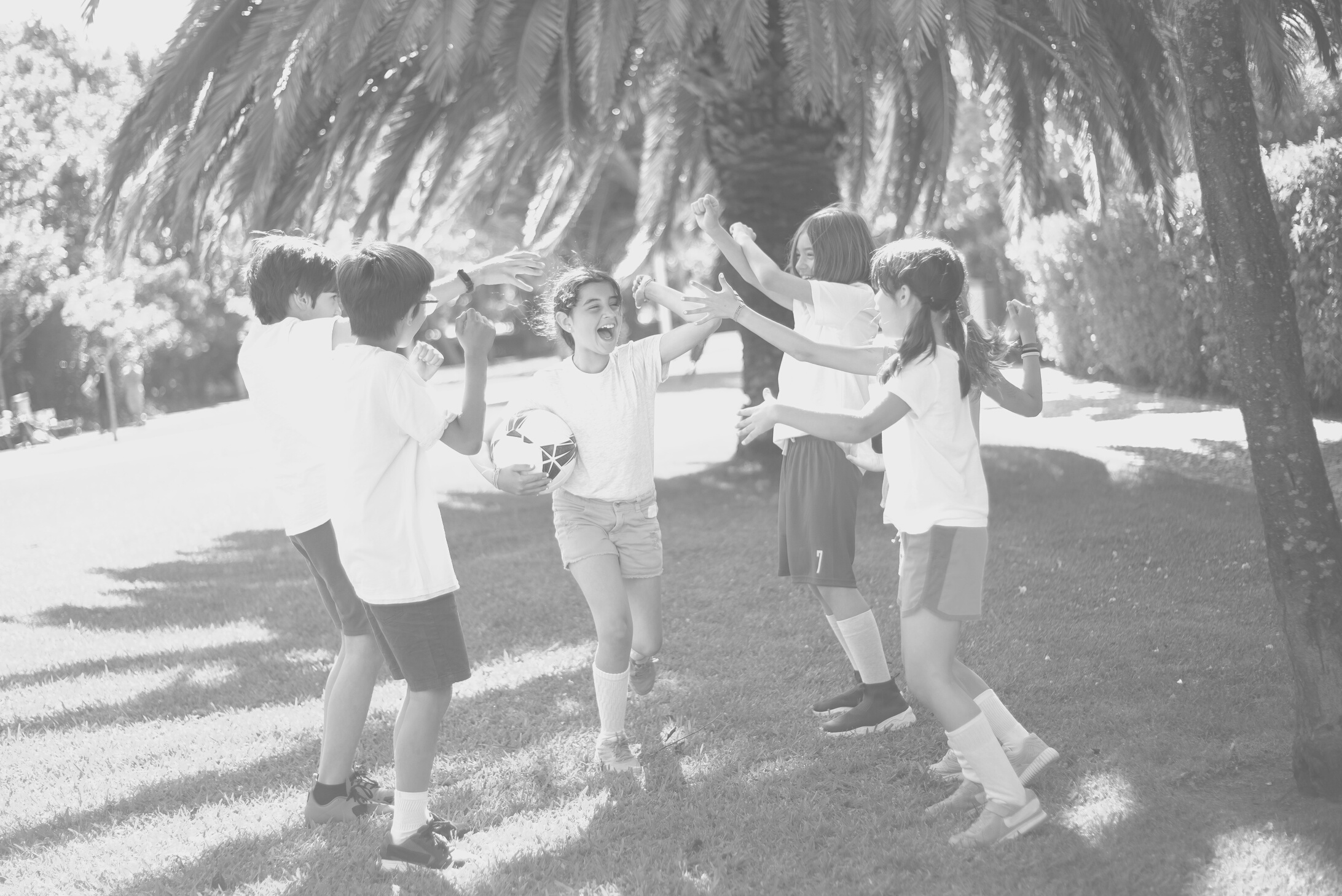 Children playing Football Together