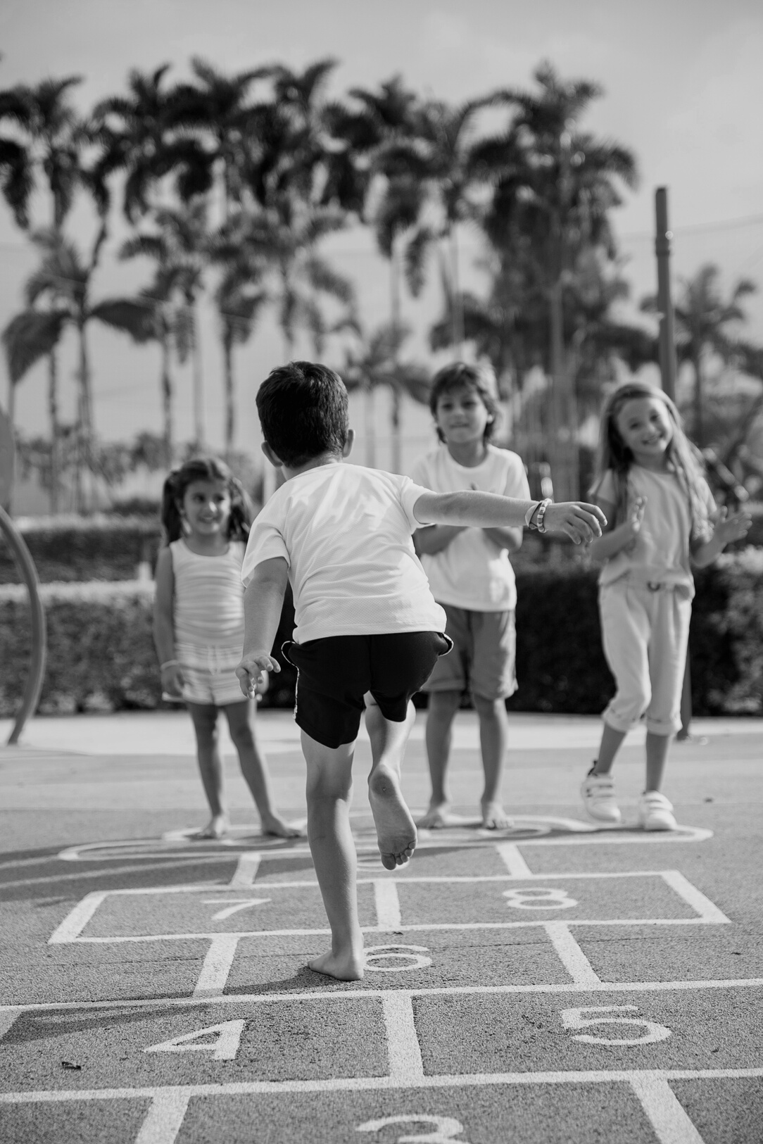 Kids Playing Hopscotch